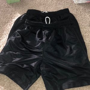 Two pairs of black basketball shorts